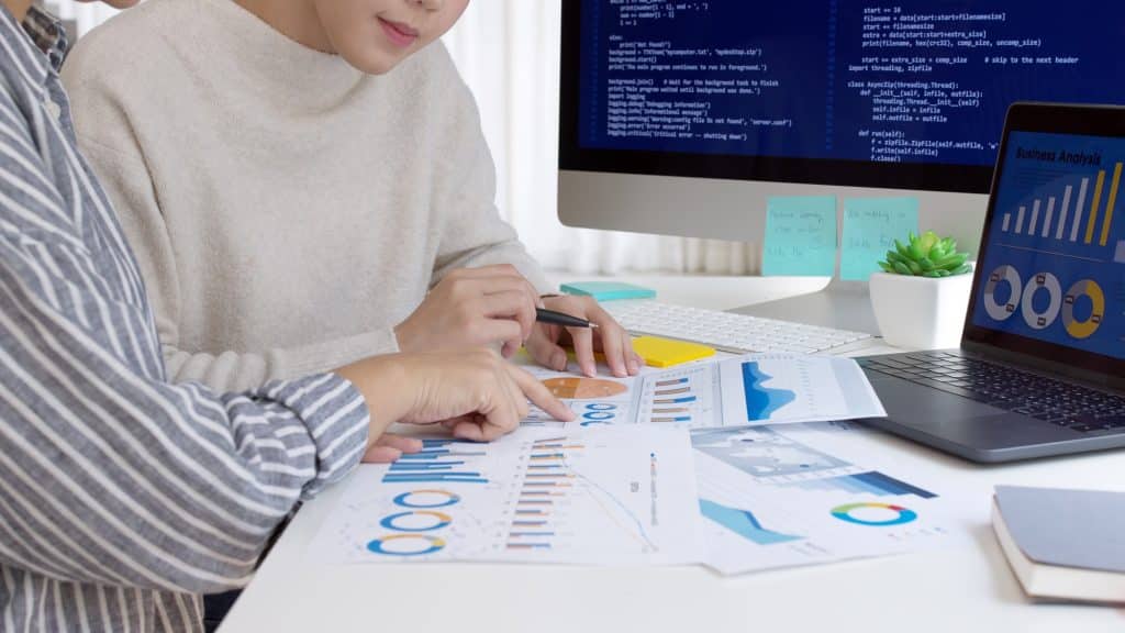 Close up two asia female people analyst coder code language laptop screen cloud online