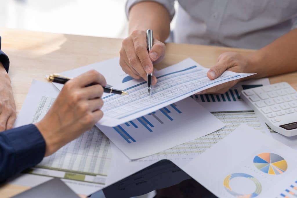 Marketing Financial analyst analysis business financial report on digital tablet during discussion a